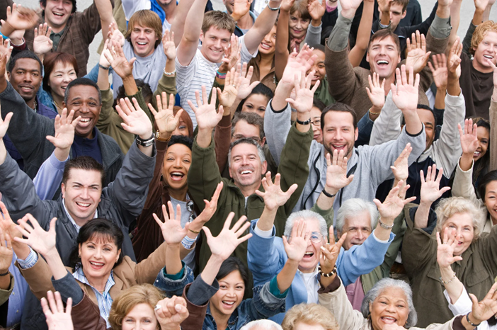 Groups_of_people_with_raised_arms_and_smiling.jpeg